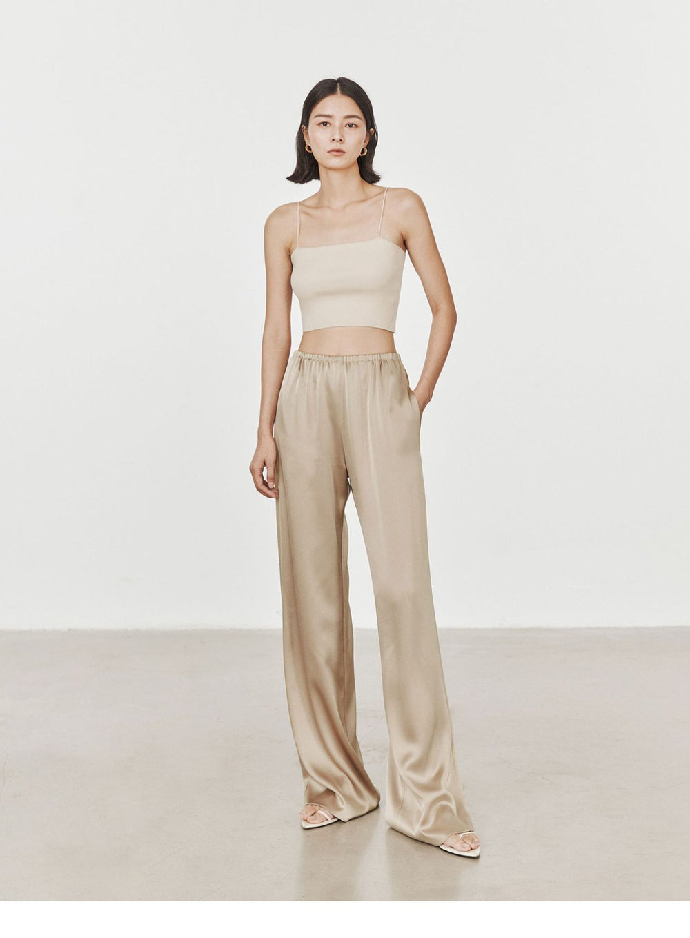 The Celeste Satin-Finish High-Waist Wide-Leg Pants in Champagne