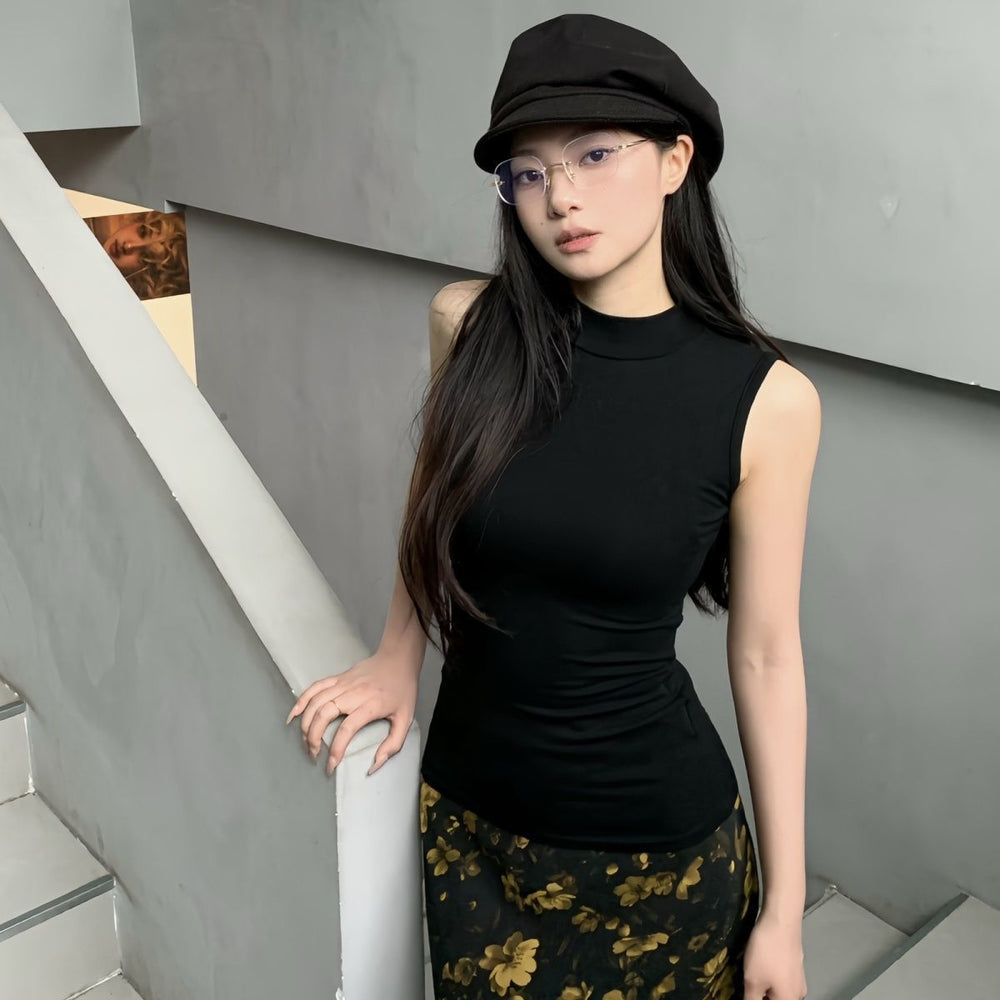 The Lina Sleeveless Mock-Neck Knit Top in Black