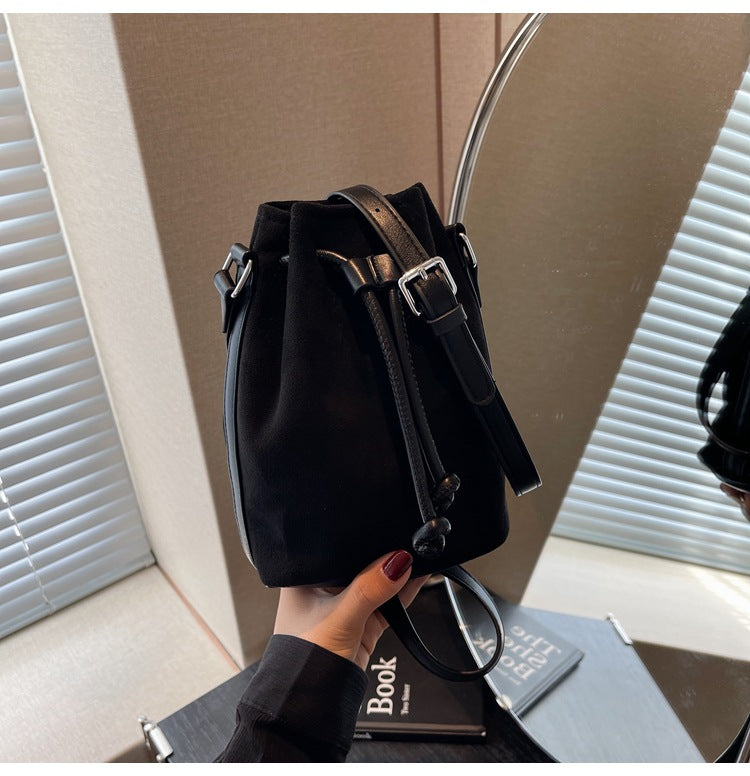 The Sienna Faux-Suede Drawstring Bucket Bag in Black